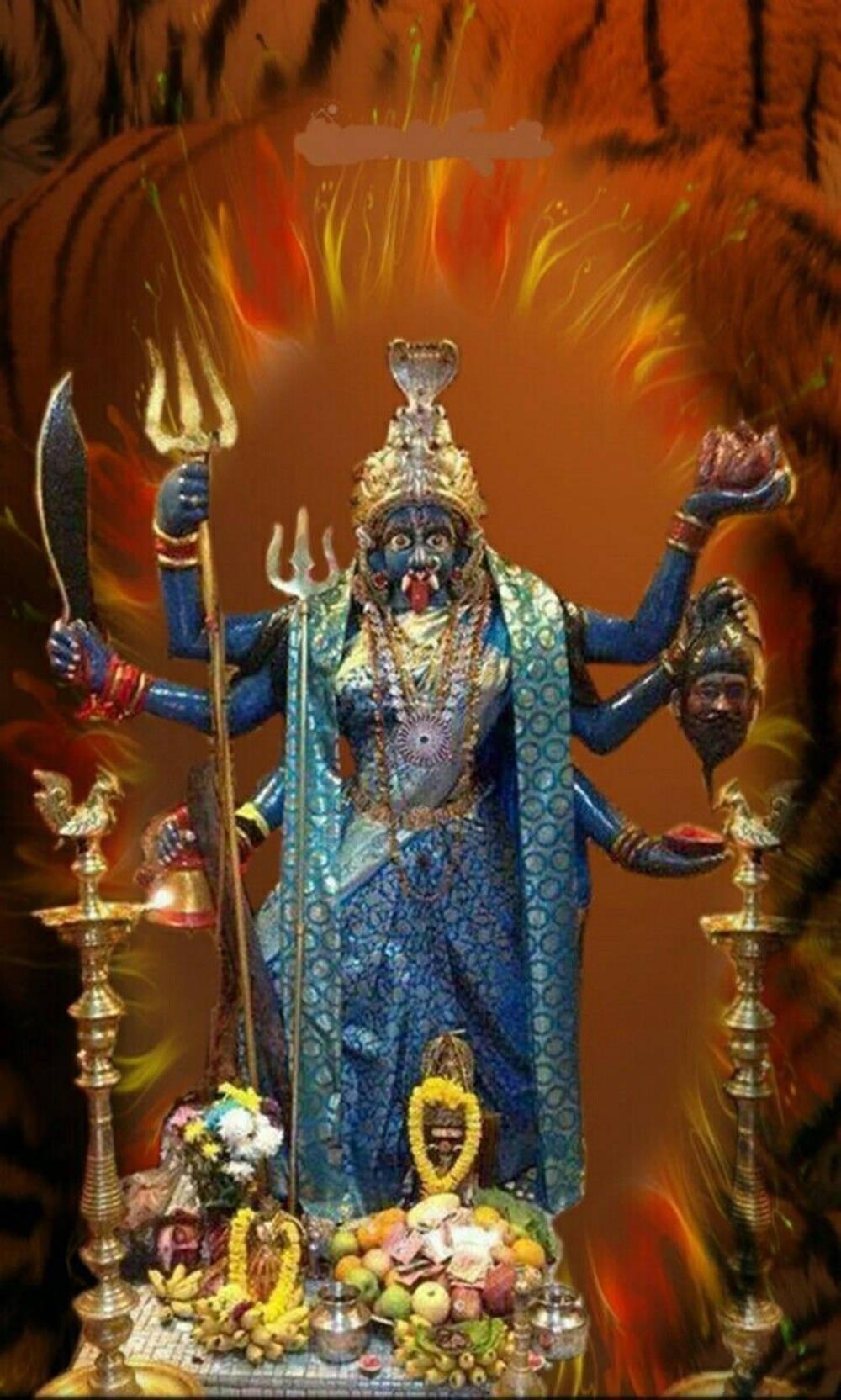 Sacred Statue of Maa Kali in Vivid Blues — 1000x1665 wallpaper