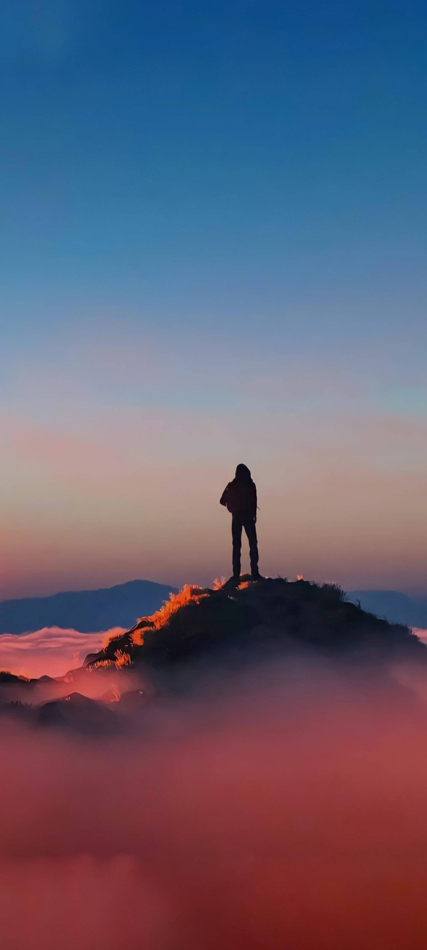 Sad Boy Cartoon On Mountain Peak — 1440x3200 wallpaper