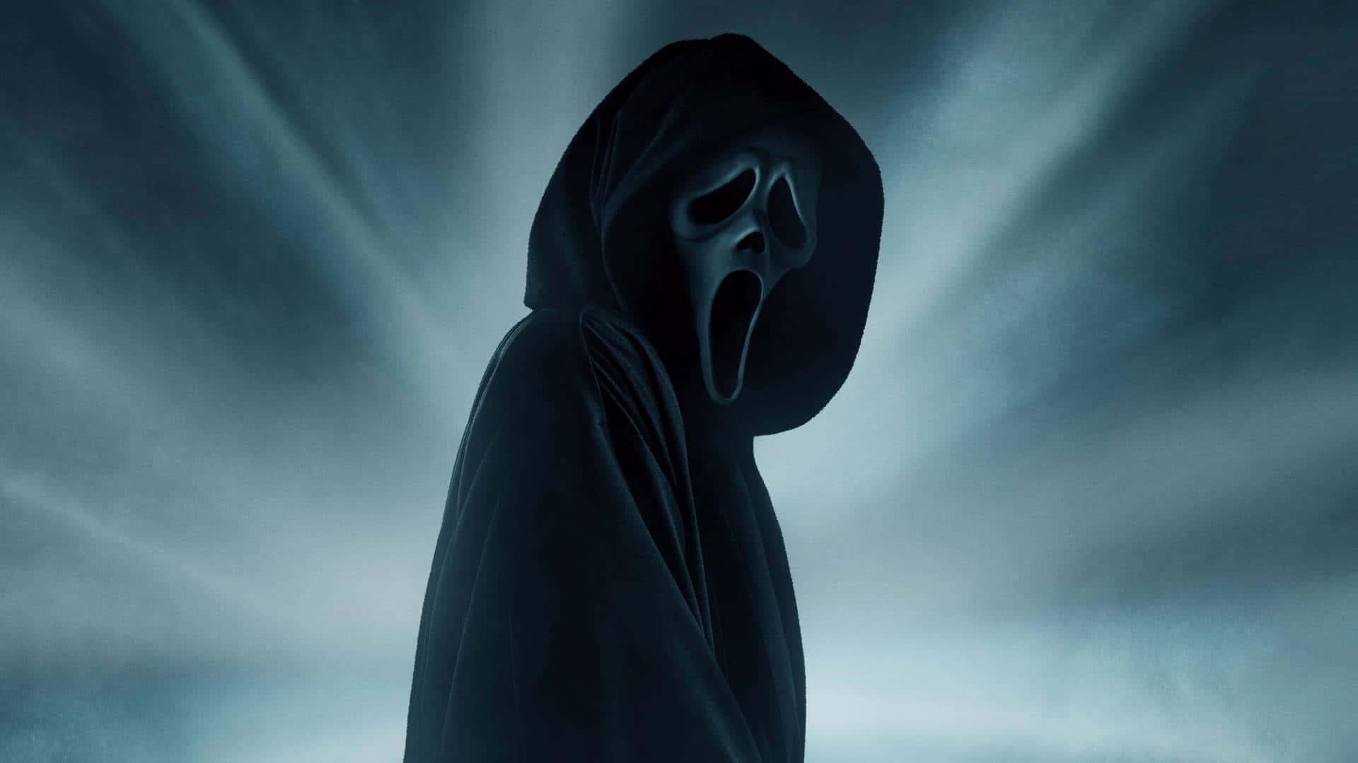 scream movie poster with a hooded man in the background — 1920x1080 wallpaper