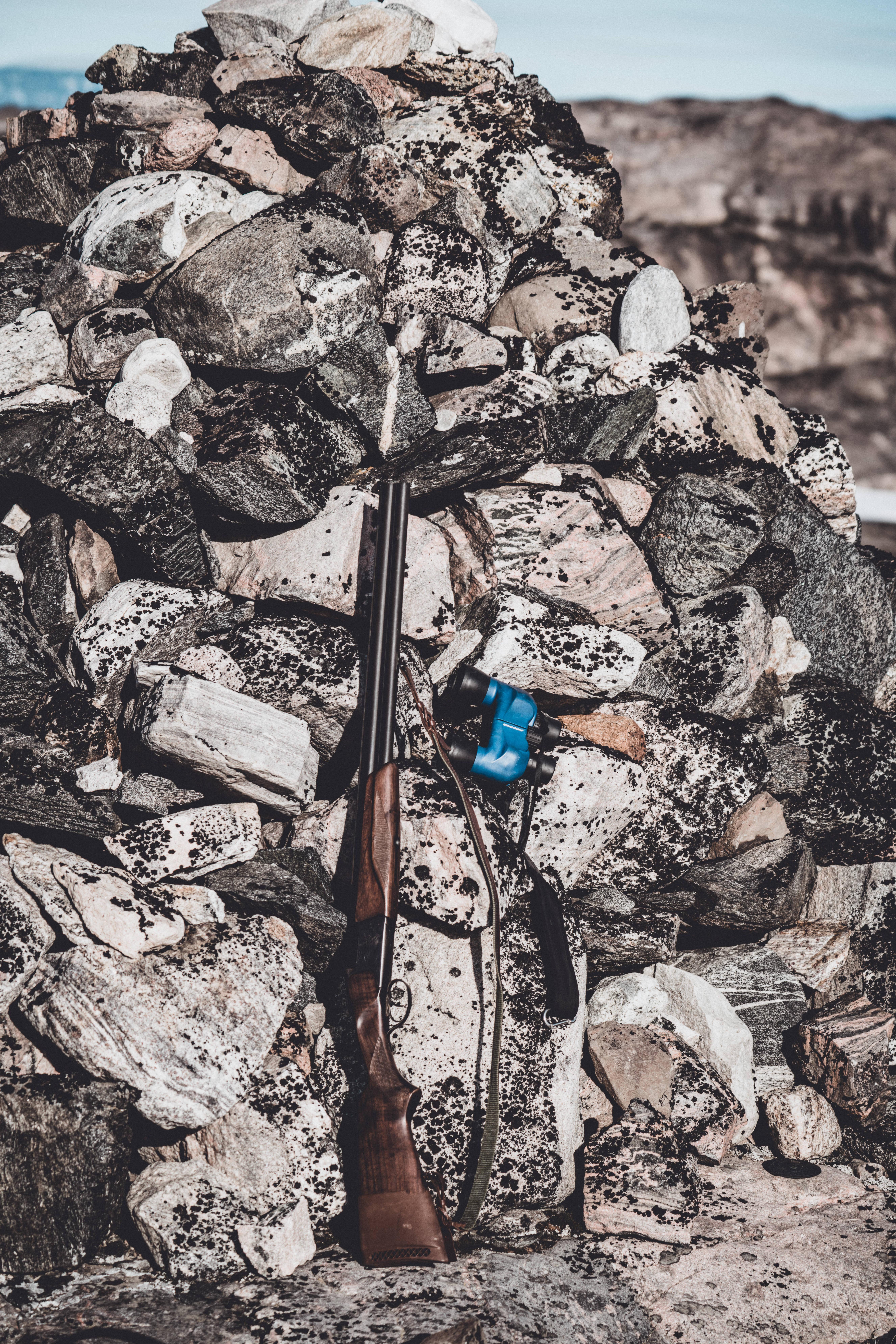 Shotgun Beside Rubble — 5304x7952 wallpaper