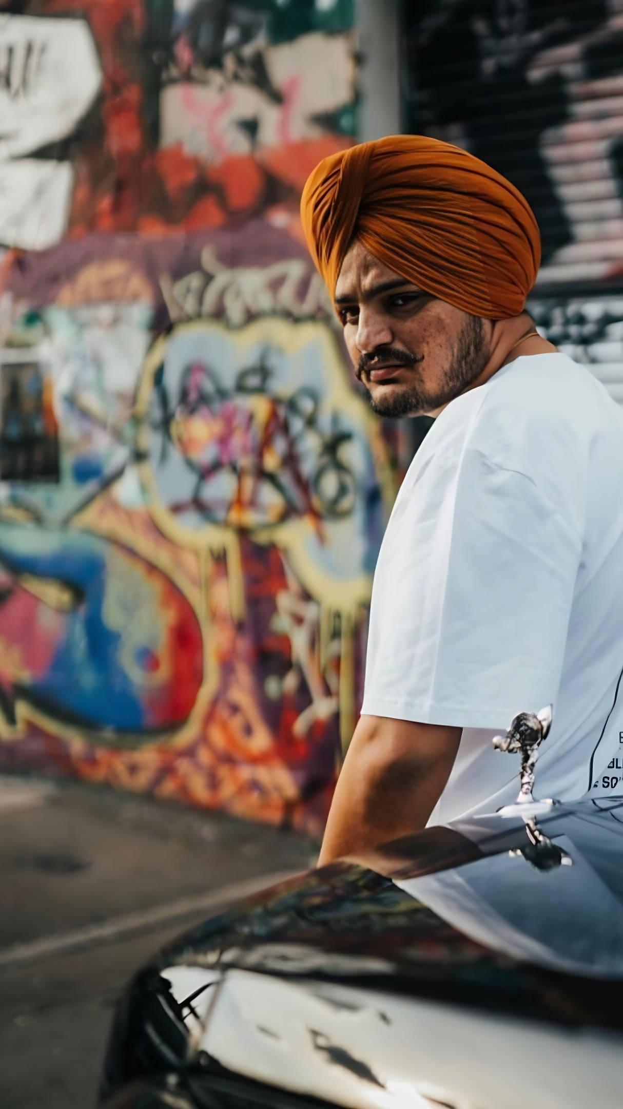 Sidhu Moose Wala Against Street Graffiti Wall