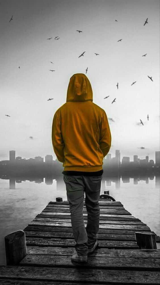 Single Boy In Yellow Hoodie — 564x1002 wallpaper