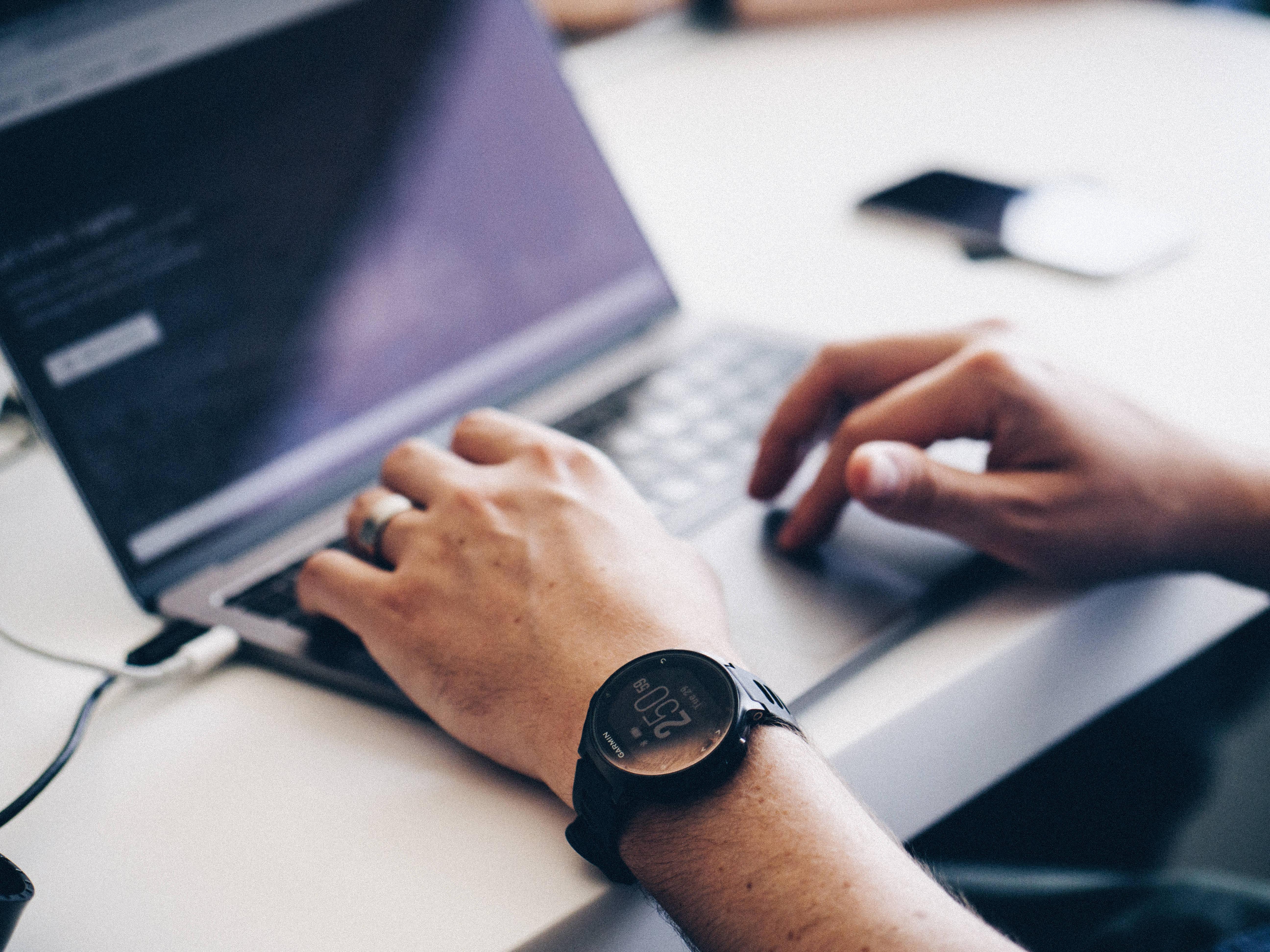 Sleek Silver Macbook Pro on a Wooden Desk — 5184x3888 wallpaper