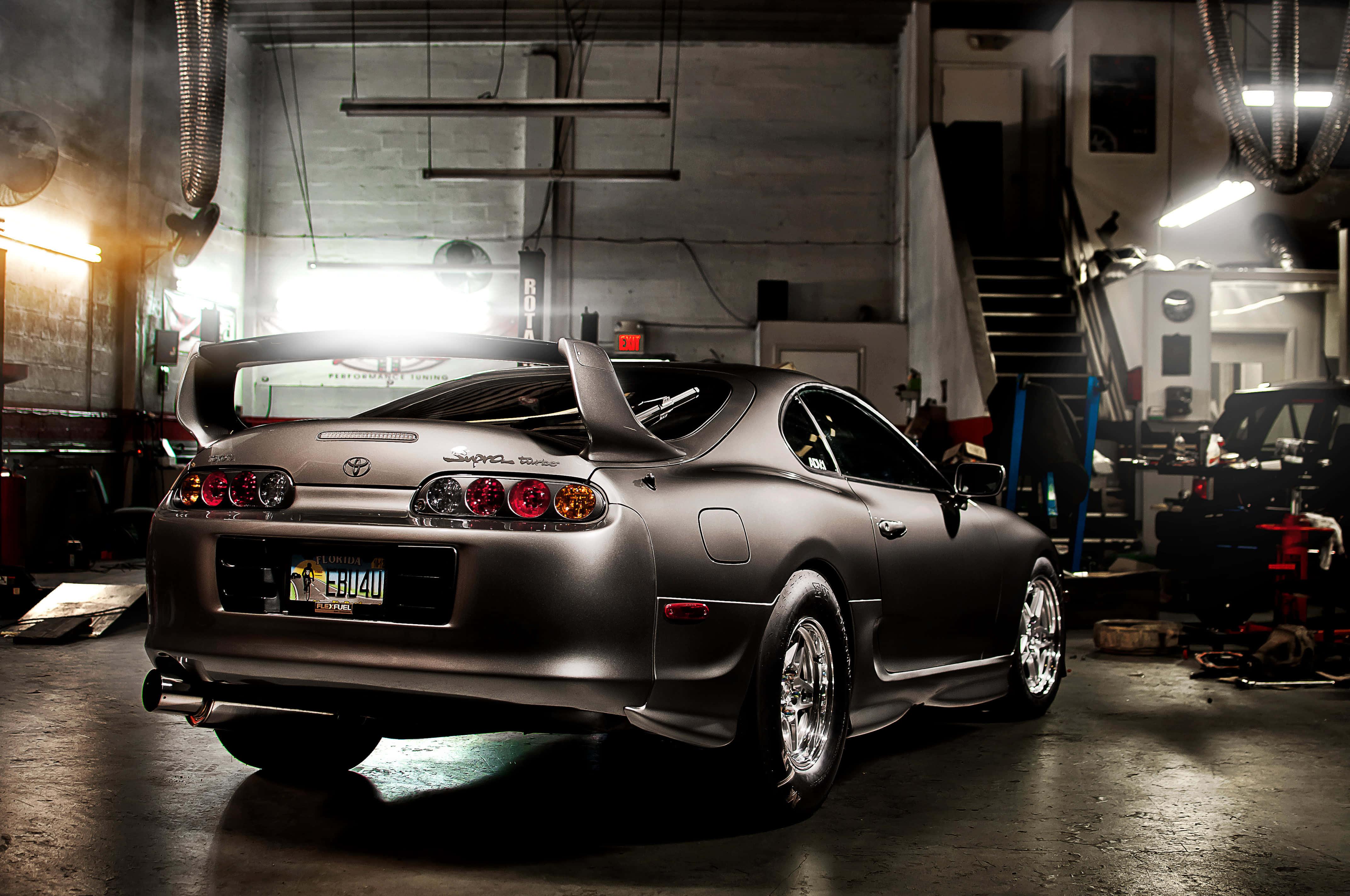 Sleek Toyota Supra sports car on a scenic mountain road — 4288x2848 wallpaper