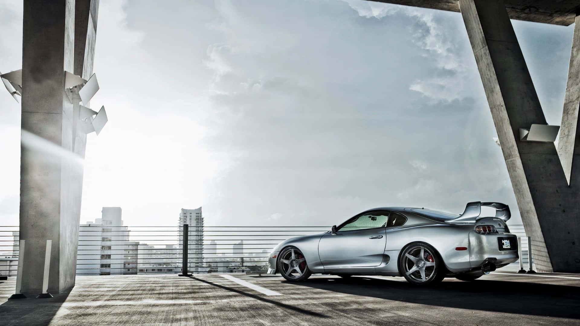 Sleek Toyota Supra sports car on a stunning road — 1920x1080 wallpaper