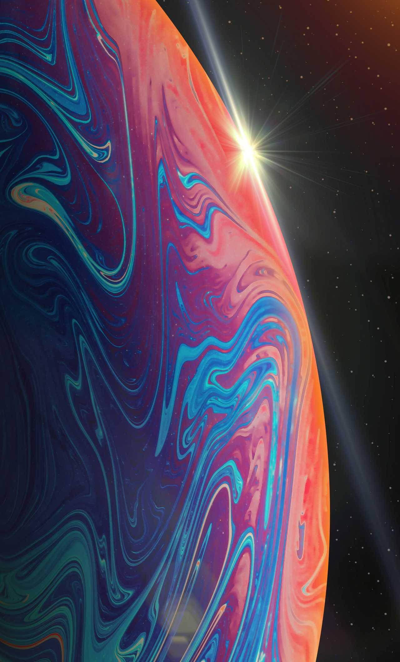 Spectacular iPhone 13 Pro featuring a Purple and Orange Planet Theme — 1280x2120 wallpaper
