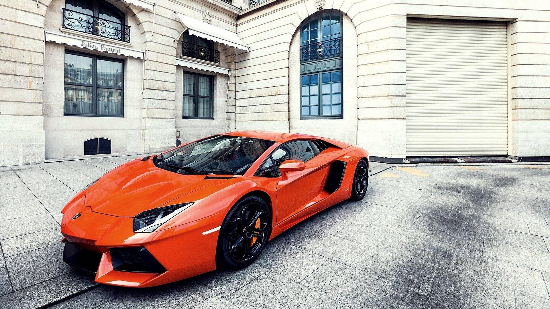 Streets of London lit up by an orange Lamborghini Aventador — 1920x1080 wallpaper
