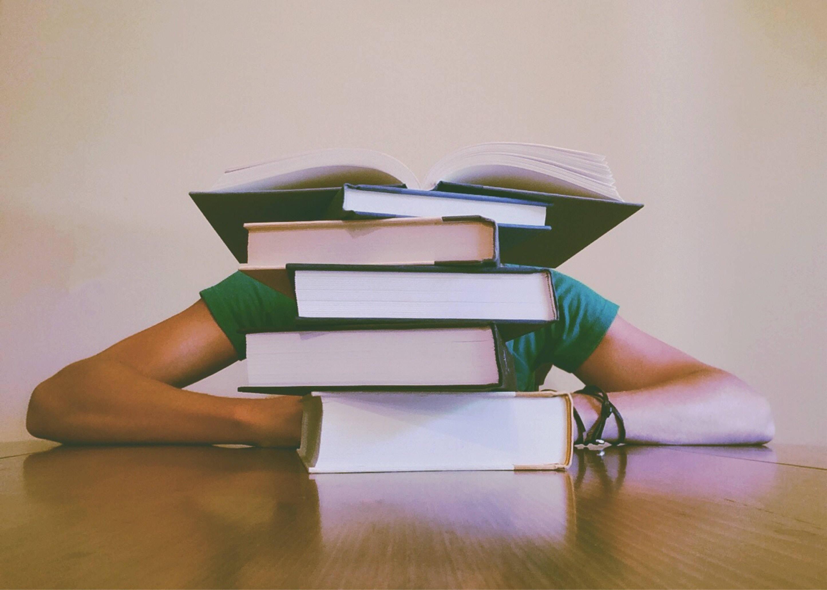 Study Motivation Tall Stack of Books on Table — 2890x2064 wallpaper