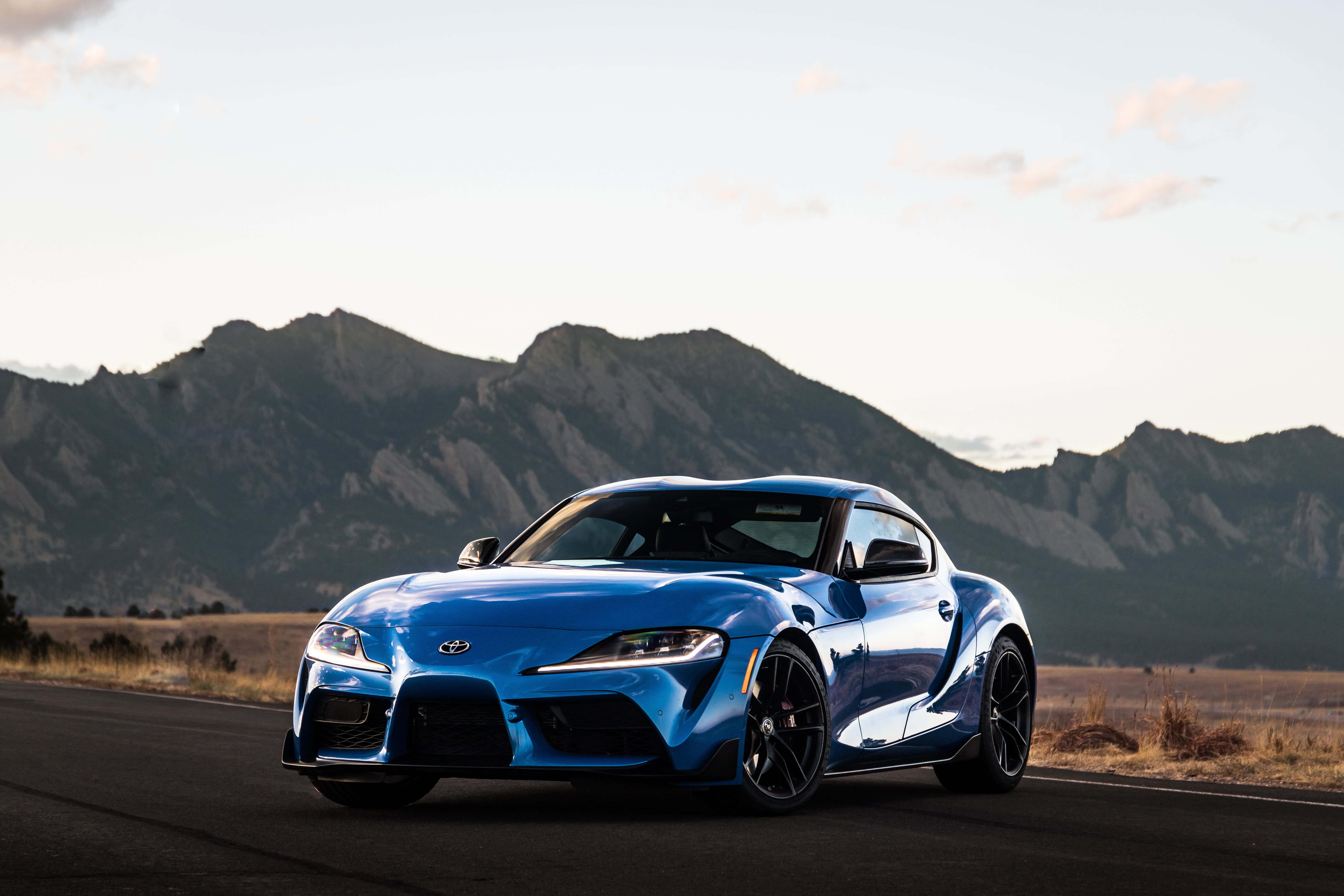 Stunning Supra sports car on a scenic road — 6240x4160 wallpaper