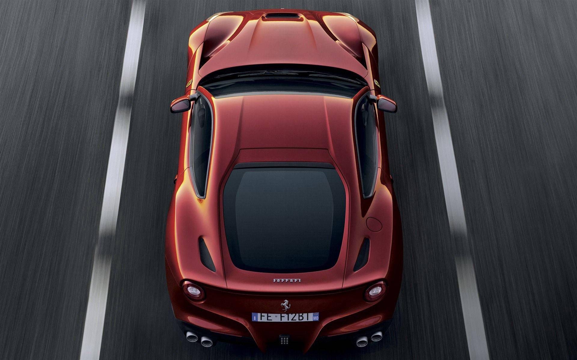 Supercar speed and power - a red Ferrari — 1920x1200 wallpaper