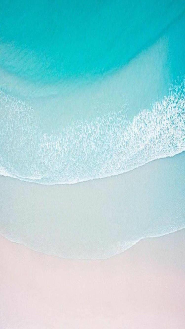 Take in the serenity of a sandy beach with the new iPhone 11 — 750x1333 wallpaper