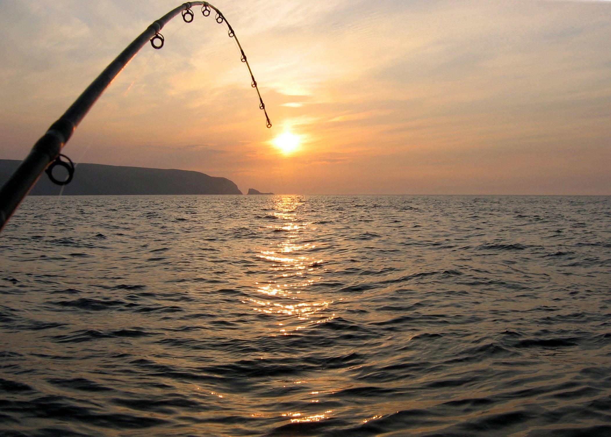 Taking a break and enjoying the peacefulness of a day on the ocean fishing — 2103x1503 wallpaper