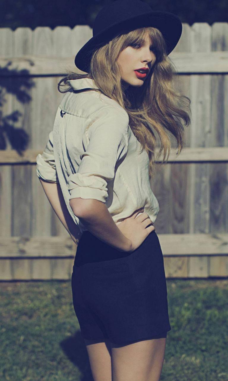 Taylor Swift Enjoys the Outdoors — 768x1280 wallpaper