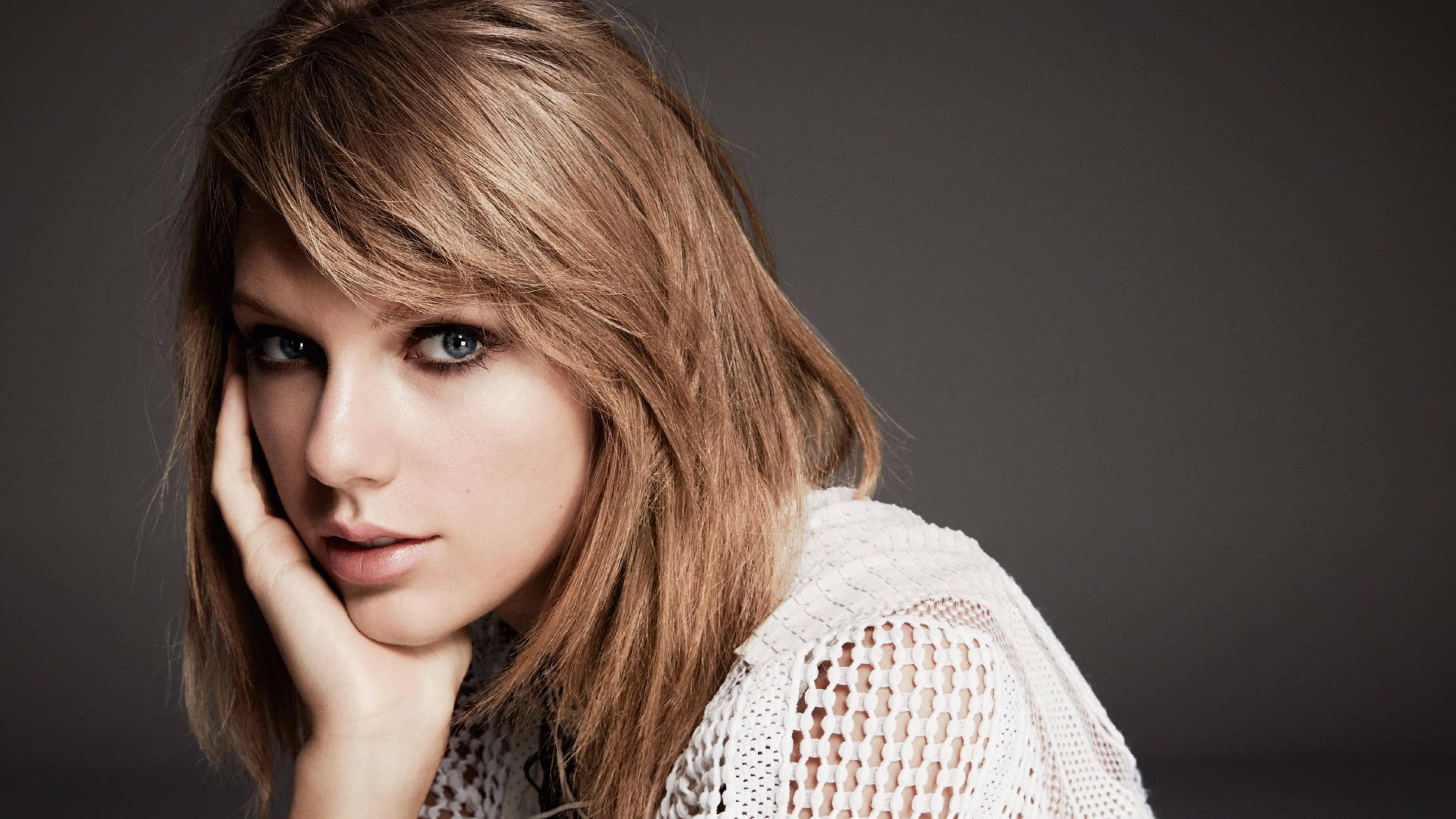 Taylor Swift in her signature whimsical style. — 3840x2160 wallpaper