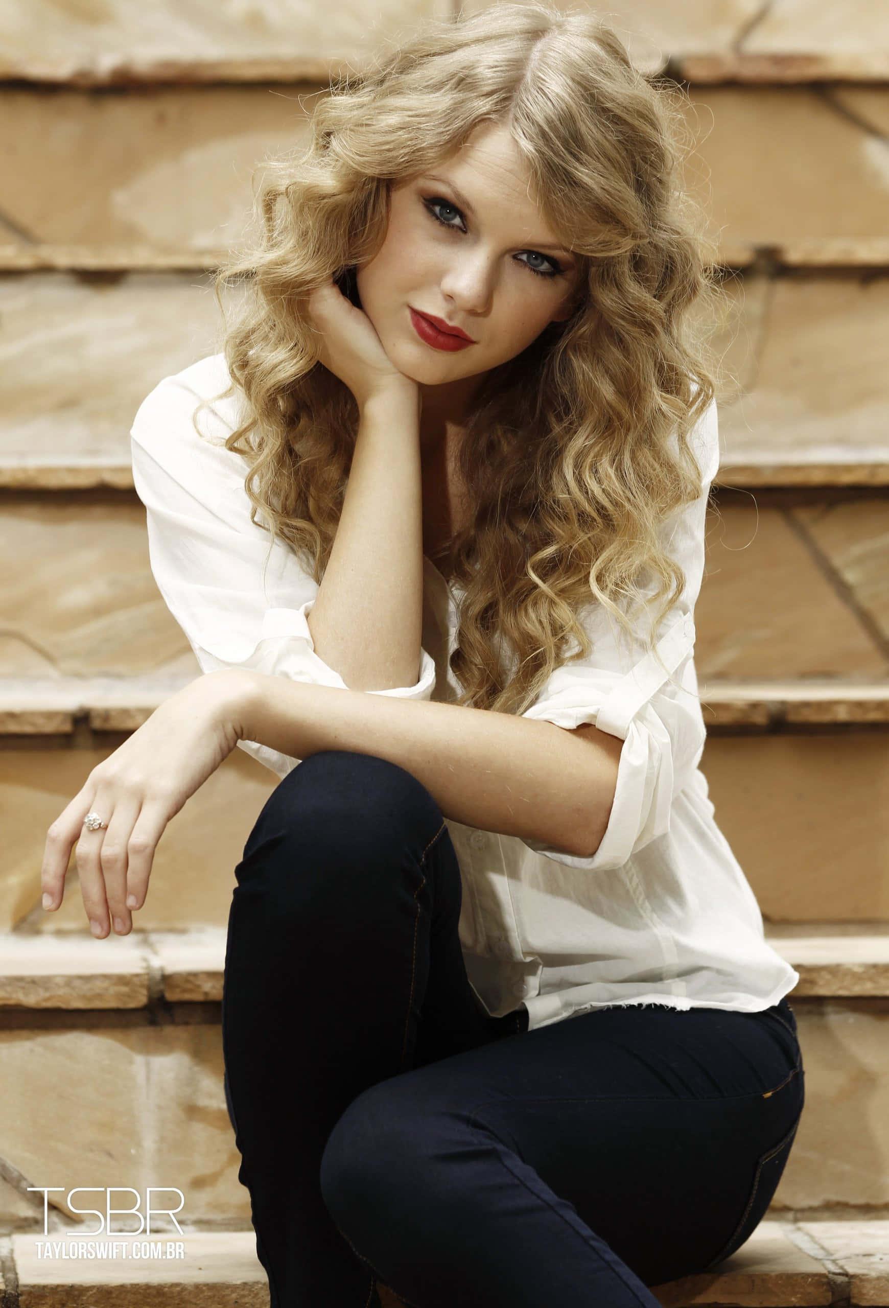 Taylor Swift singing in a neon orange dress — 1740x2560 wallpaper