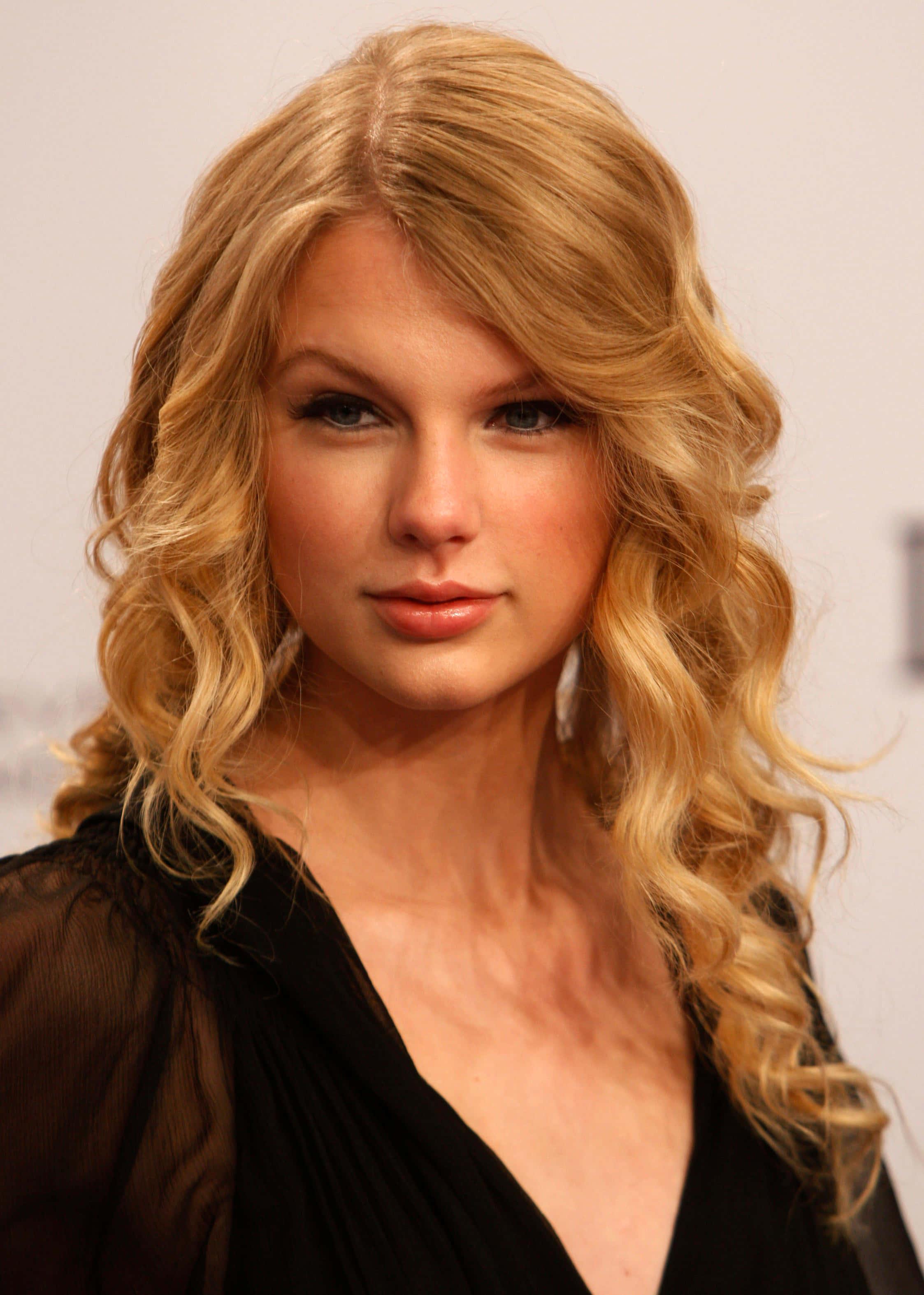 Taylor Swift singing on stage during a concert — 2246x3146 wallpaper
