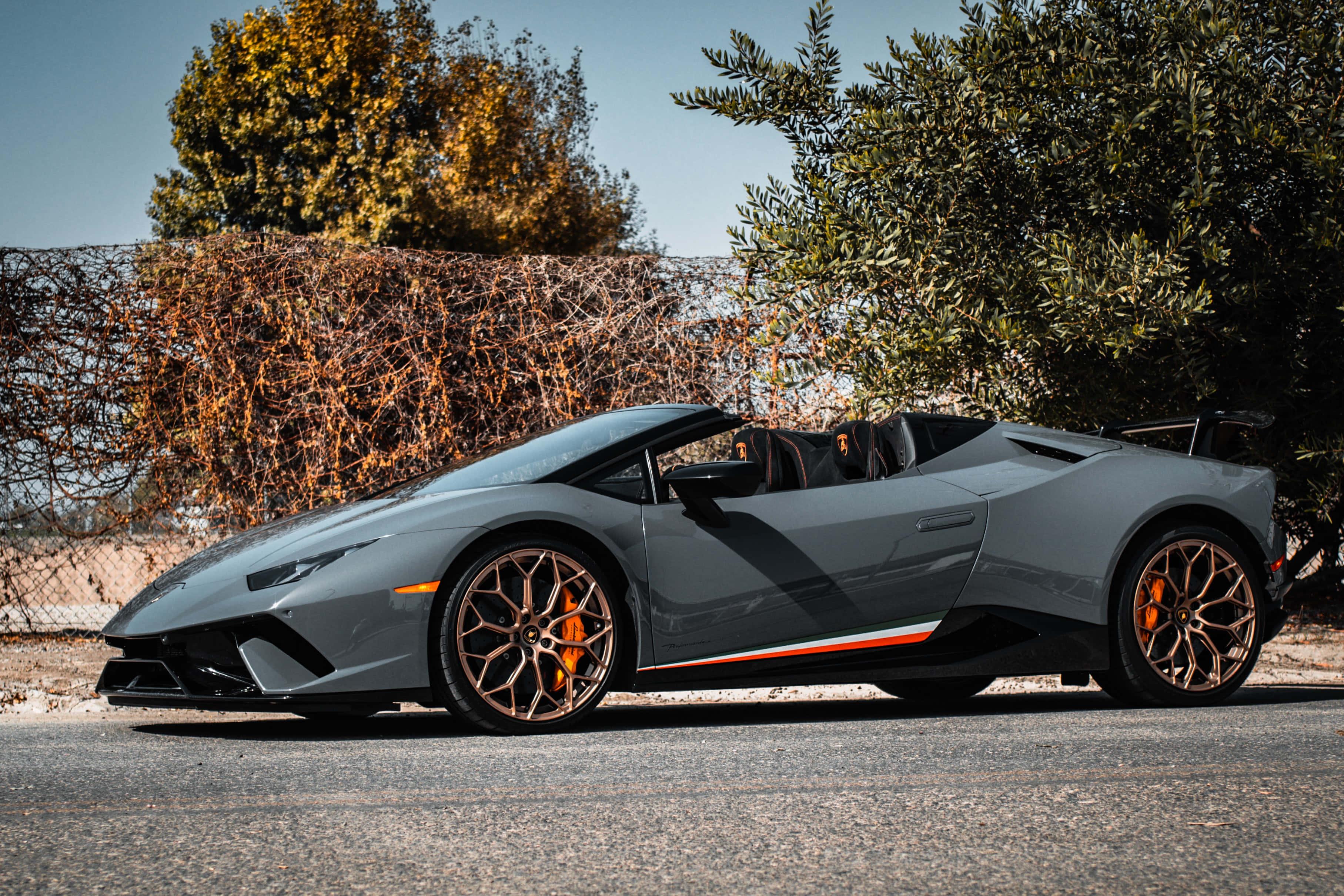 the 2019 lamborghini huracan parked on the side of the road — 3630x2420 wallpaper