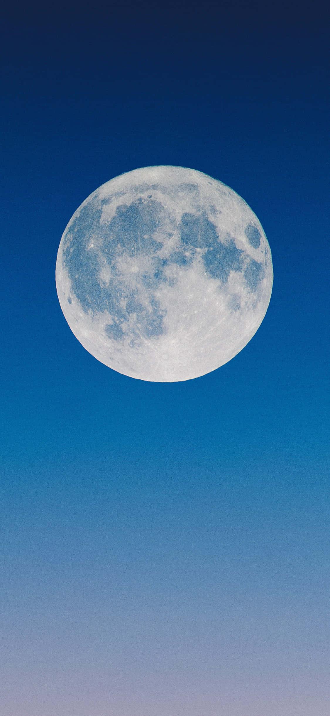The Moon Blue Shot iPhone — 1125x2436 wallpaper