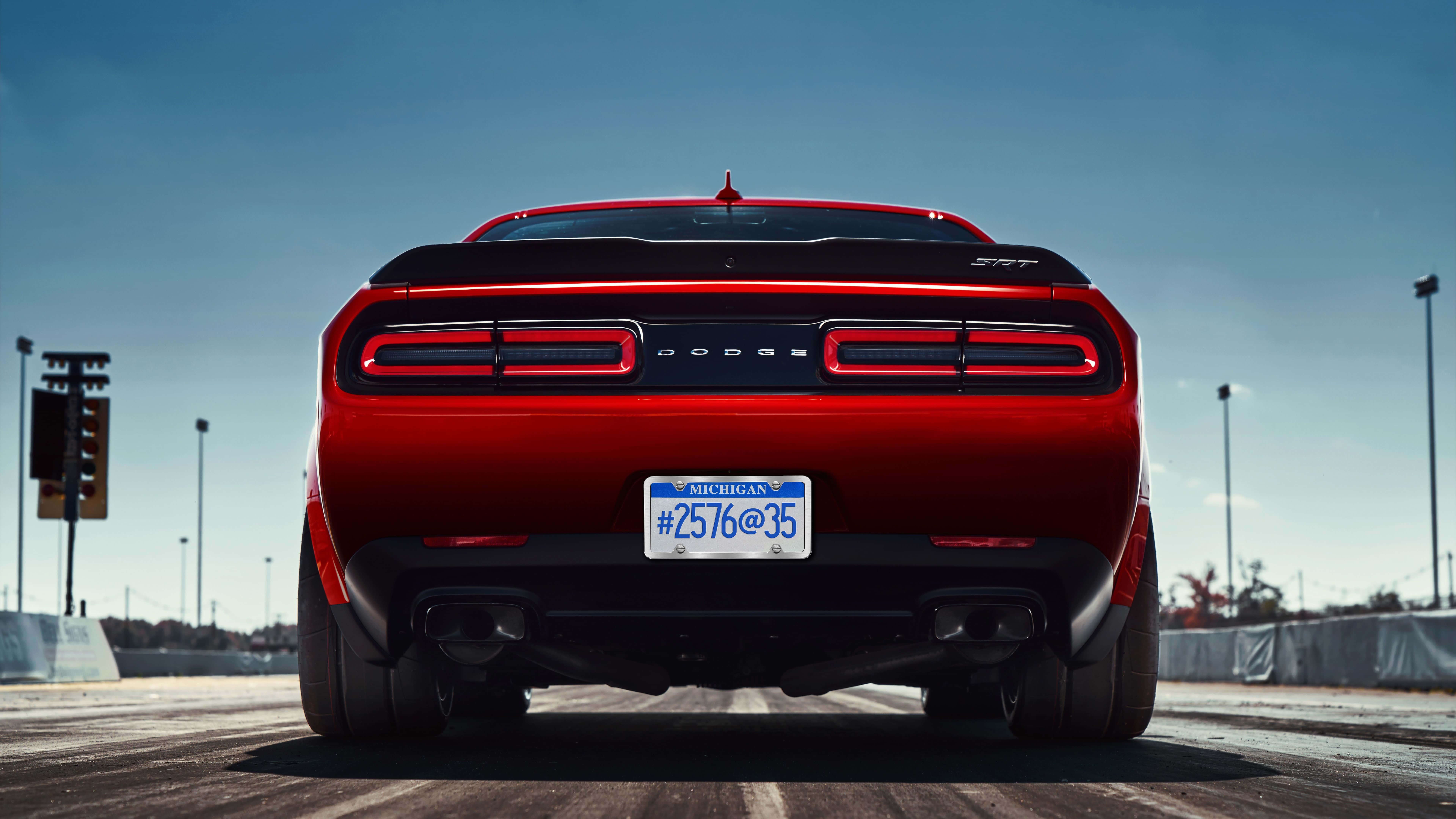 the rear end of a red dodge challenger — 7680x4320 wallpaper