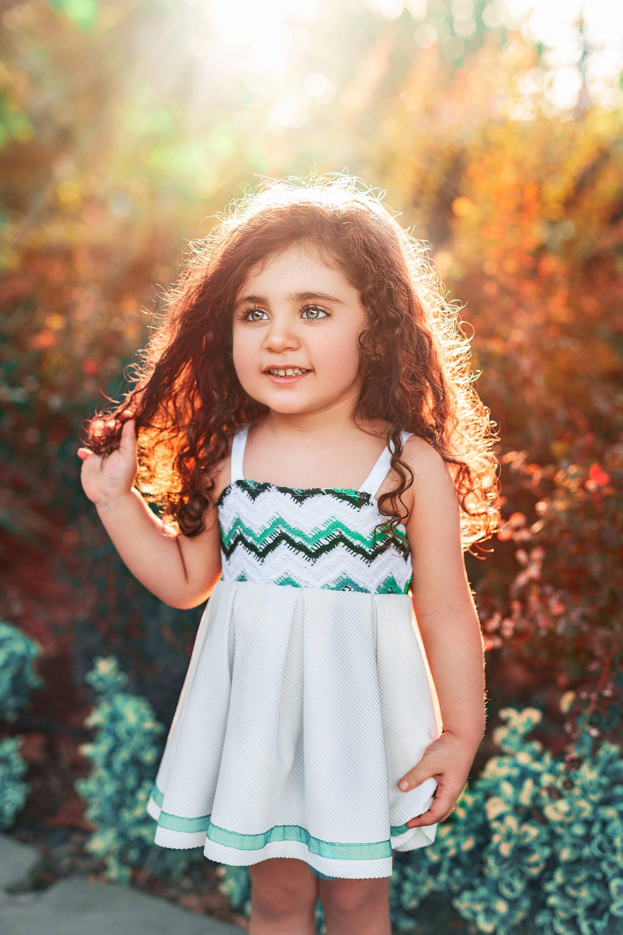 This beautiful curly-haired baby girl is ready to explore the world! — 2160x3238 wallpaper