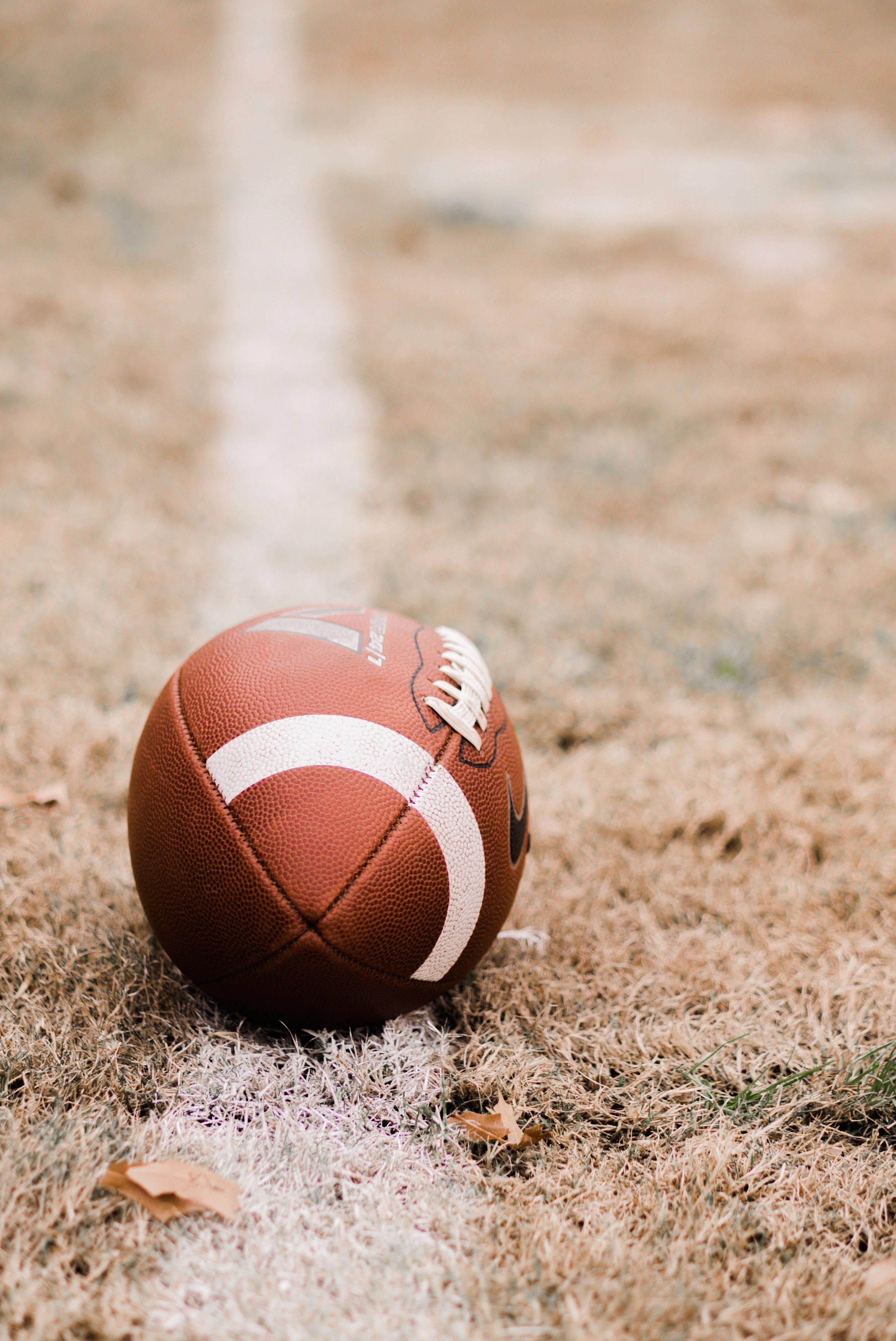Unleashing ultimate power and agility on the football field! — 2672x4000 wallpaper