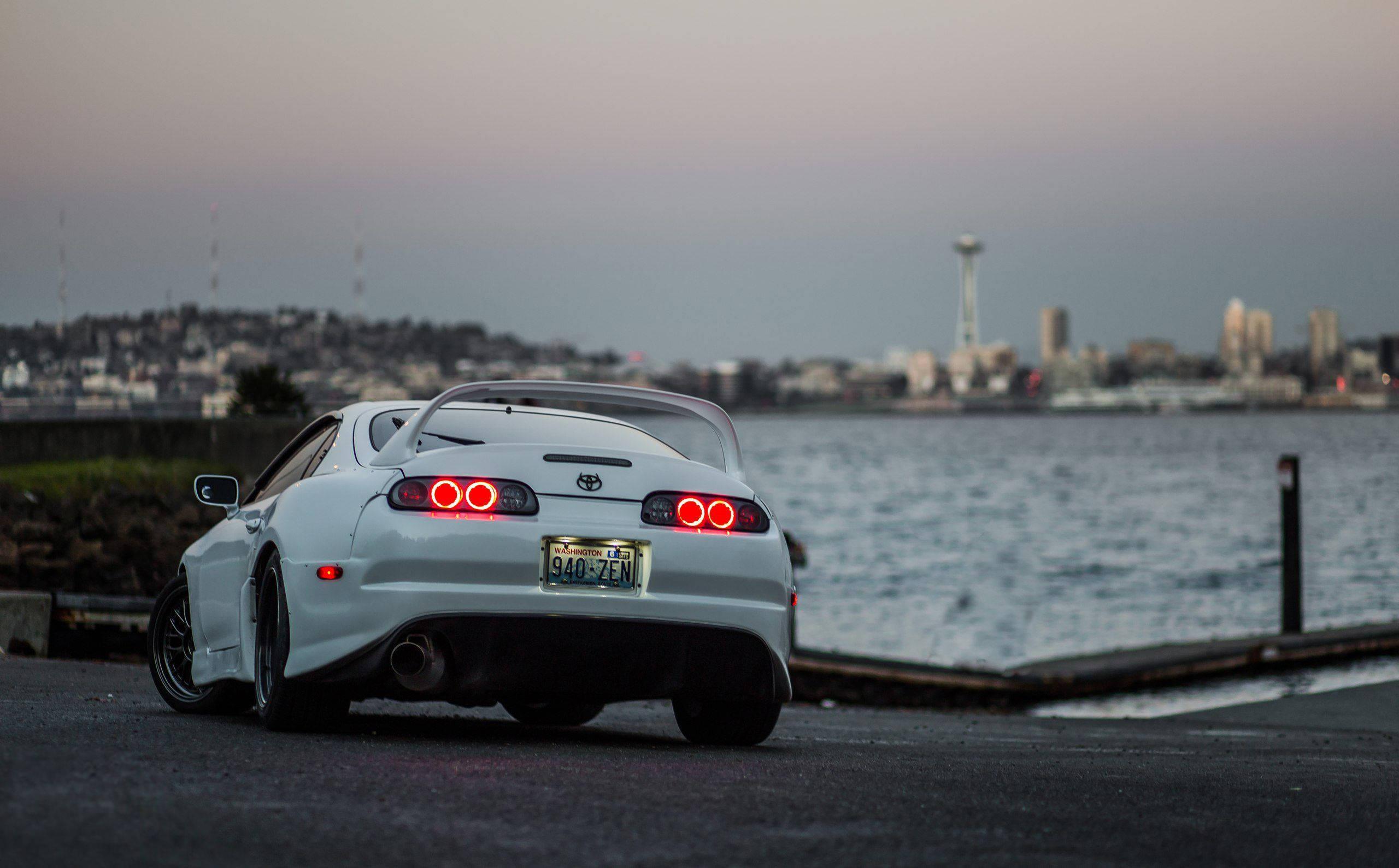 White Toyota Supra Car Near Bay — 2560x1589 wallpaper