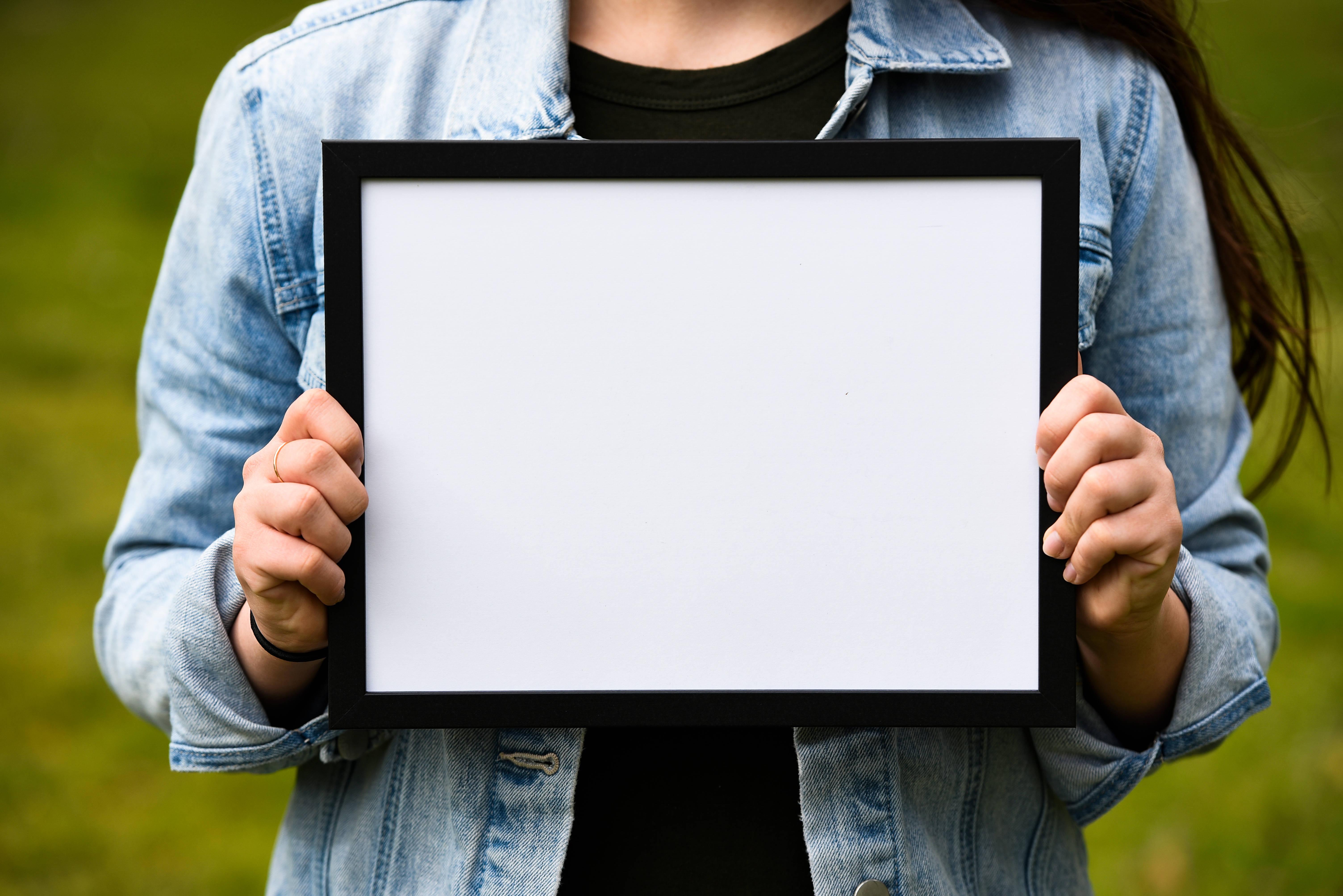 Woman Holding Photo Frame — 6016x4016 wallpaper